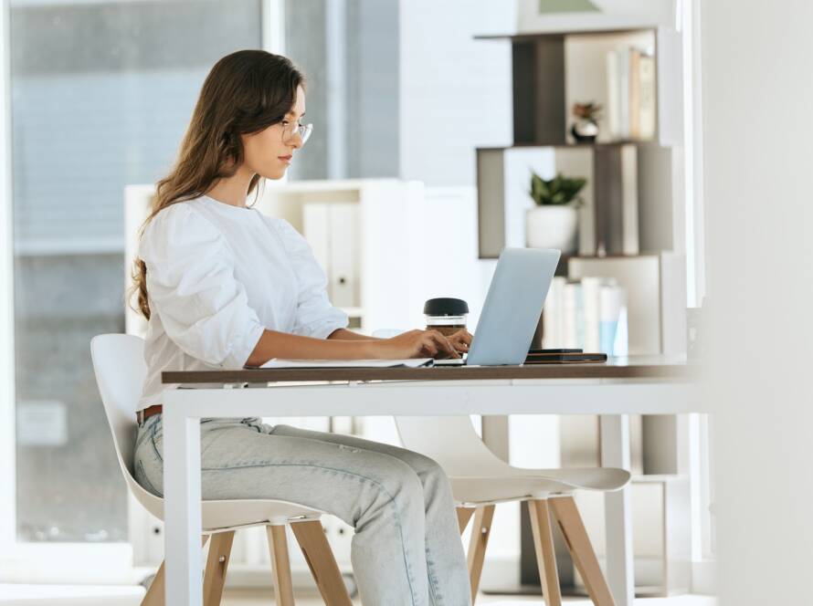 Woman, working and laptop at digital marketing company, eco startup and work with technology at des